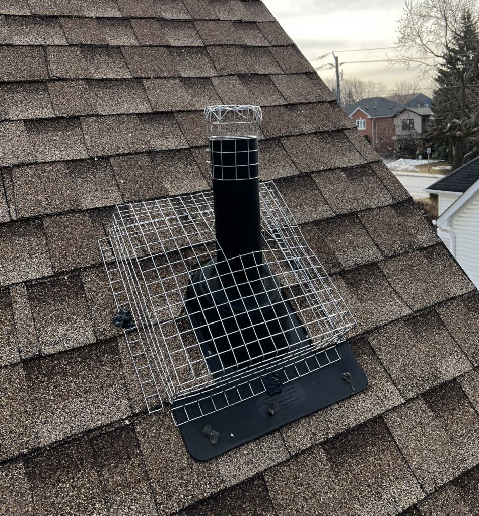 Person working on squirrel guard installation